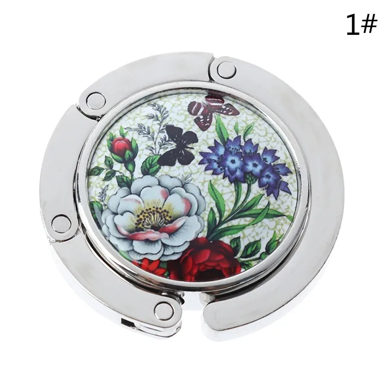 cintre sac main métal motifs floraux pierres précieuses voyage organisation support table bureau colours variées usage quotidien voyage