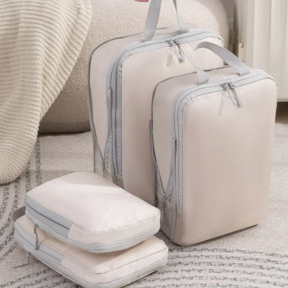 Organisateur Voyage Polyester Blanc Bandes Grises Format Rectangulaire Poignées Grises Compression Vêtements Articles Toilette Rangement Valise