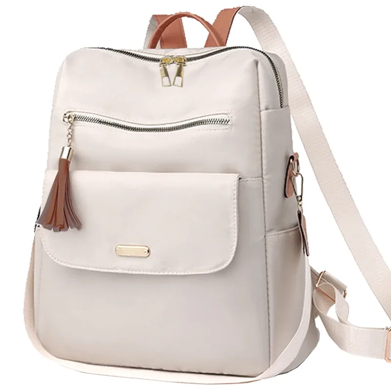 sac à dos chic et élégant multicolore avec détail pompon, sangle réglable, léger pour un usage quotidien, sac décontracté, fonctionnel et tendance