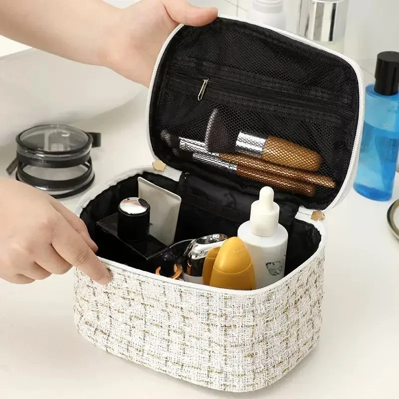 trousse toilette tweed luxe blanc doré zip double poignée supérieure compartiments multiples voyage femmes