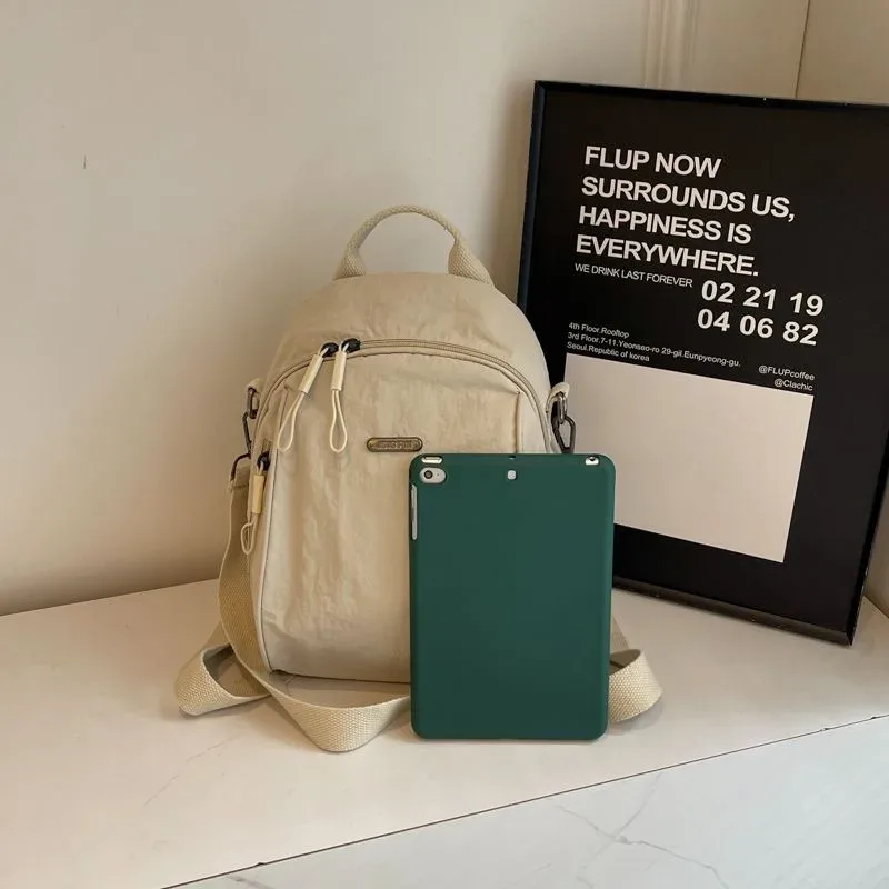mini sac à dos multifonctionnel en nylon, sac de voyage convertible décontracté à bandoulière pour femme, sac à dos quotidien multi-poches pour l'extérieur