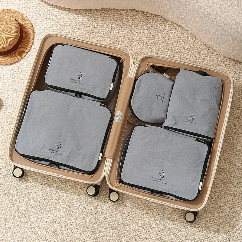 ensemble de cinq sacs de rangement de voyage compressibles en taslon, sac de rangement pour sous-vêtements, sac de rangement portable, pour organiser et trier les affaires en voyage.