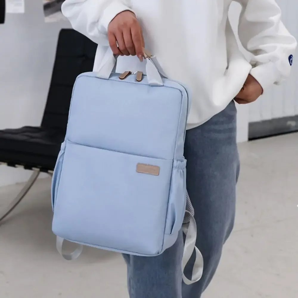 sac dos nylon bleu rose pâle noir antichoc imperméable poche téléphone épaules confortables usage voyage école