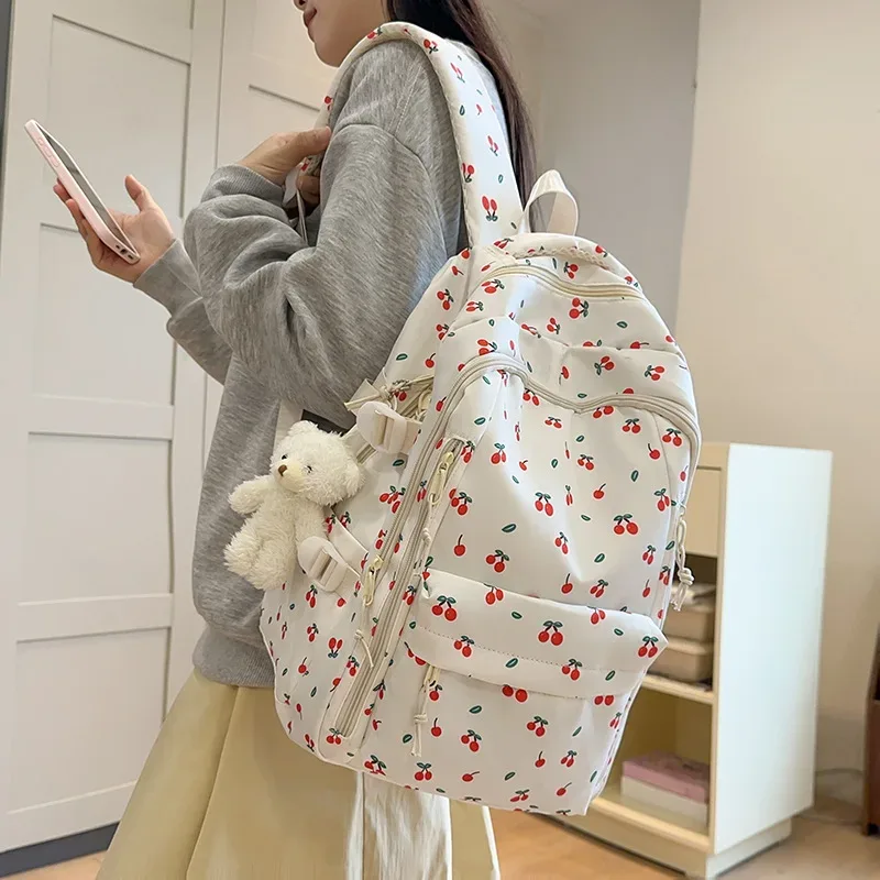 sac à dos décontracté à imprimé floral grande capacité pour filles, sac d'école en nylon imperméable, capacité pour ordinateur portable 14 pouces, style frais et doux