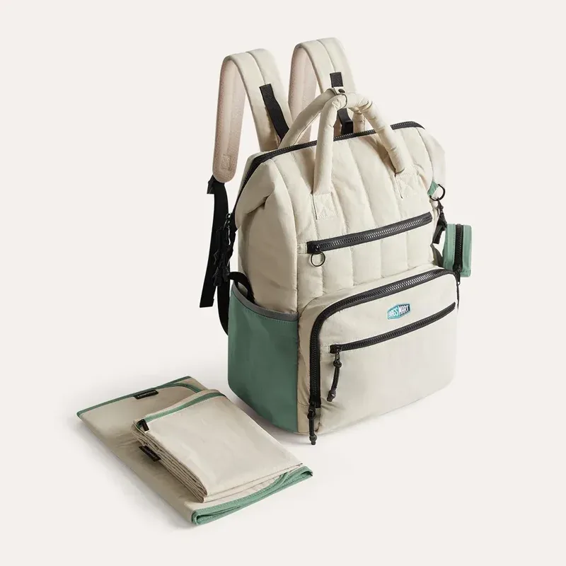 sac dos polyester beige accents verts poches multiples grande capacité maternité sorties mains libres bébé ordinateur portable