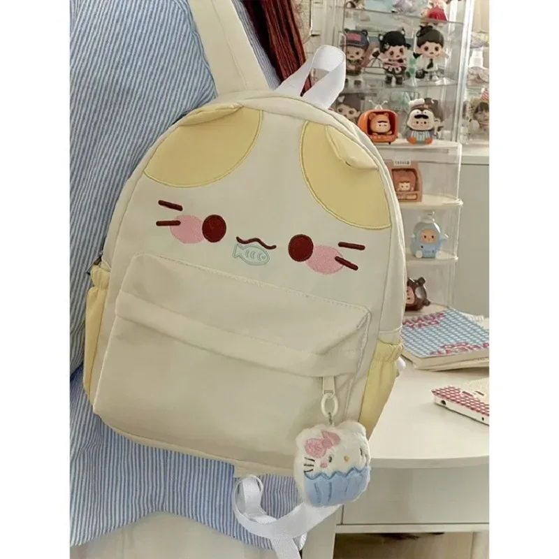 sac à dos imperméable en nylon pour femme avec motif chat dessinant une fille mangeant du poisson, sac d'école pour filles avec détails brodés, sac à livres