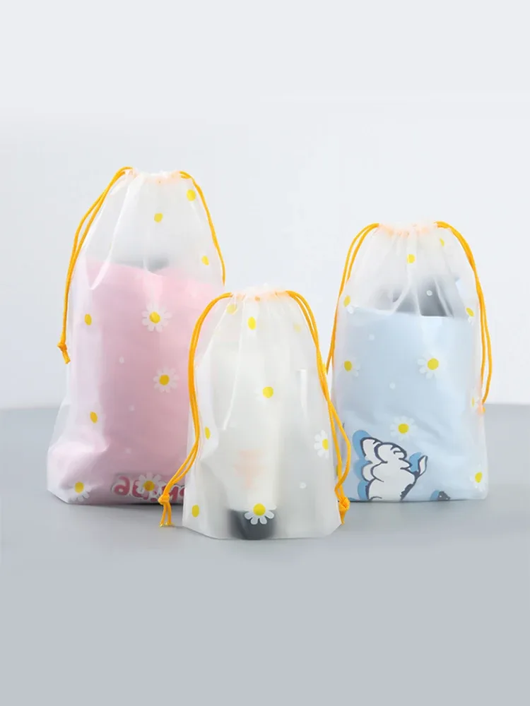 organisateur voyage transparence motif fleurs blanches fond gris corde jaune nylon plastique petit moyen grand