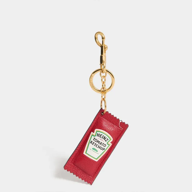 pochette sac vintage forme sachet ketchup rouge dentelé chaîne dorée accessoire sacoche sac dos humour voyage