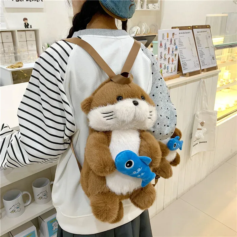 Sac à dos en peluche Otter mignon tenant une poissonnière, sac à bandoulière tendance Kawaii pour filles, sac décontracté adorable pour étudiantes, cadeau pour petite amie