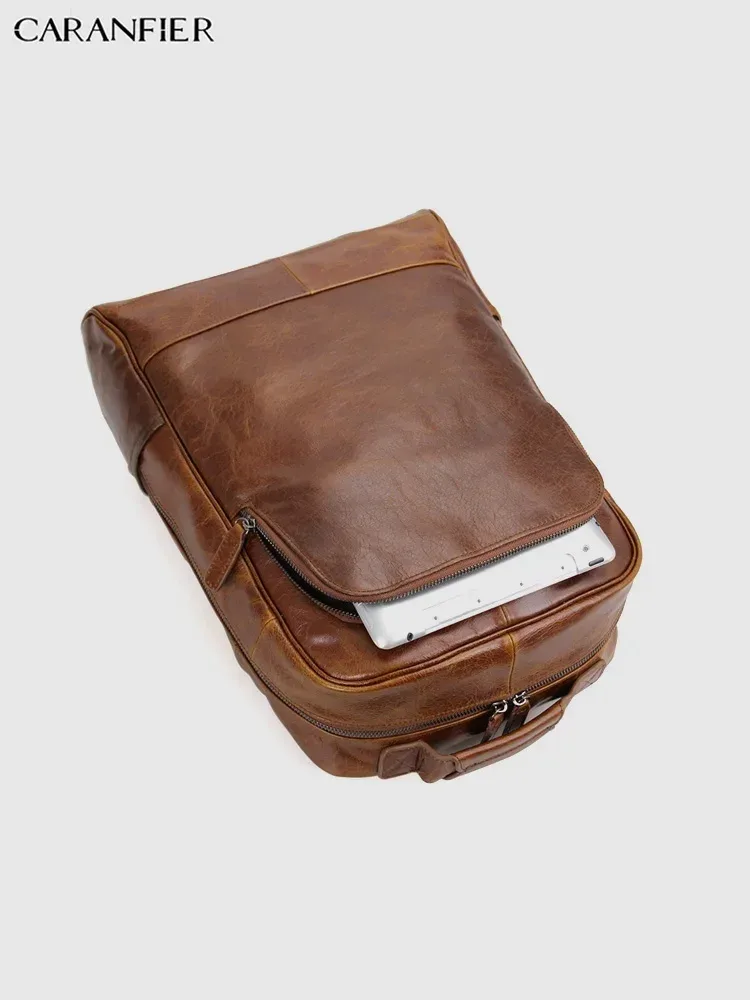 sac dos cuir véritable marron foncé poignées boucles métalliques pochette latérale bandoulière arquée fermeture éclair informatique voyage