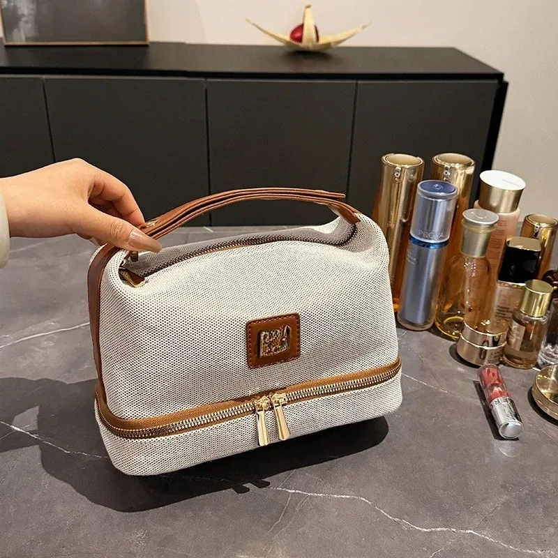 nouvelle trousse de maquillage portable en toile rétro de luxe avec étiquette métallique, de haute qualité et multifonctionnelle, idéale pour les voyages.