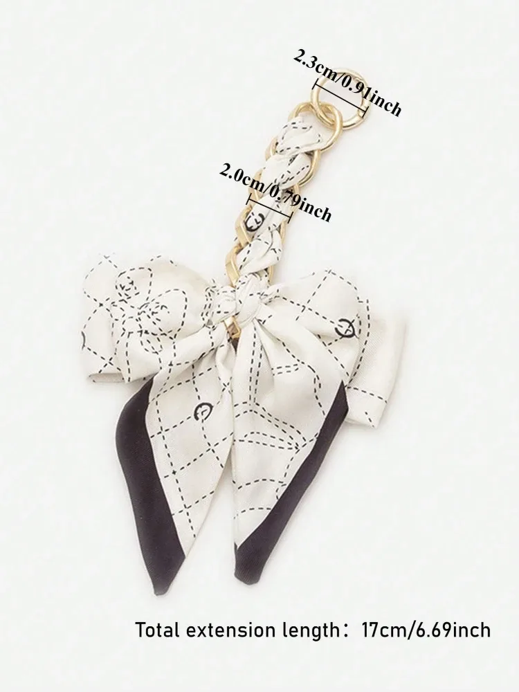 pochette poignée tressée zinc motif géométrique noire blanche accessoire voyage femelle bandoulière sangle transport