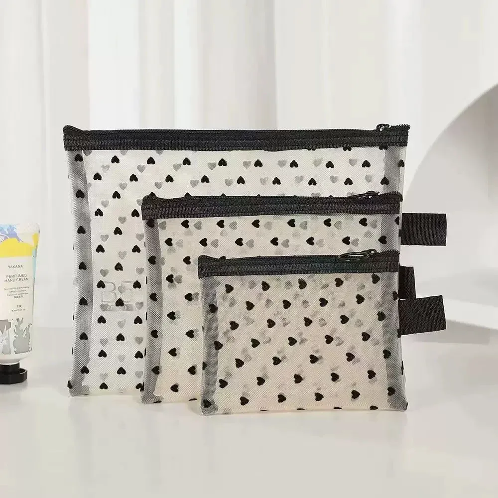 trousse toilette nylon transparents coeurs noirs fond gris petit moyen grand voyage cosmétiques maquillage