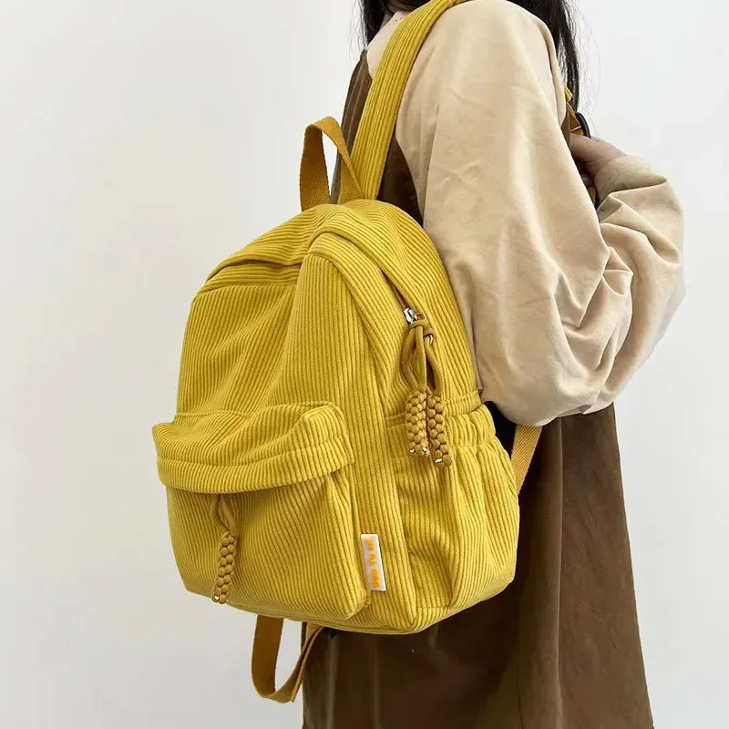 sac dos velours cotelé gris compartiment intérieur bandoulière arquée fermeture éclair usage etudiant femmes