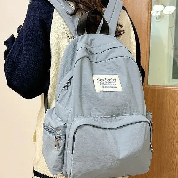 nouveau sac à dos de voyage décontracté pour femme 2025 – léger, grande capacité, imperméable en nylon, double bretelle, style frais et doux 14