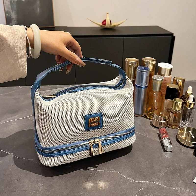nouvelle trousse de maquillage portable en toile rétro de luxe avec étiquette métallique, de haute qualité et multifonctionnelle, idéale pour les voyages.