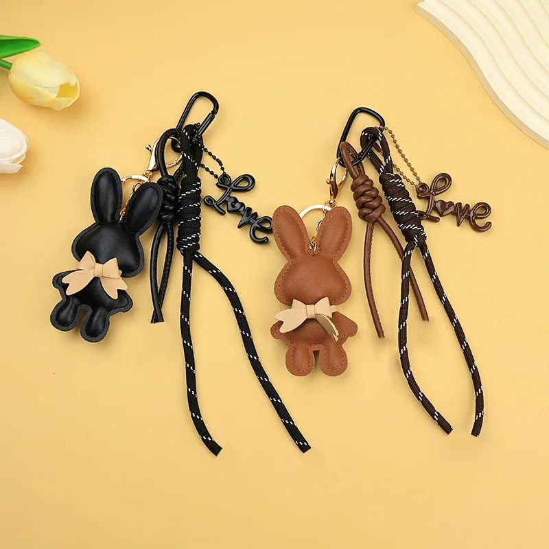 adorable porte-clés en cuir pu en forme de lapin avec petit nœud, pendentif animal mignon pour sacs à main et sacs à dos.
