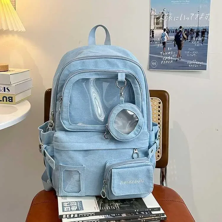 sac dos jean polyester noir bleu beige forme rectangulaire poches latérales transparentes visibilité intérieure informatique ceinture air décontracté usage quotidien