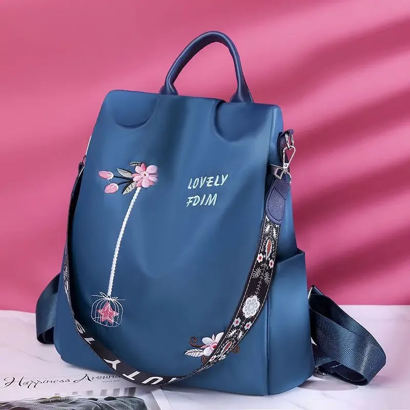 sac à dos oxford imperméable pour femmes, sac d'école antivol à la mode, sac à main de voyage de grande capacité avec broderie de styliste