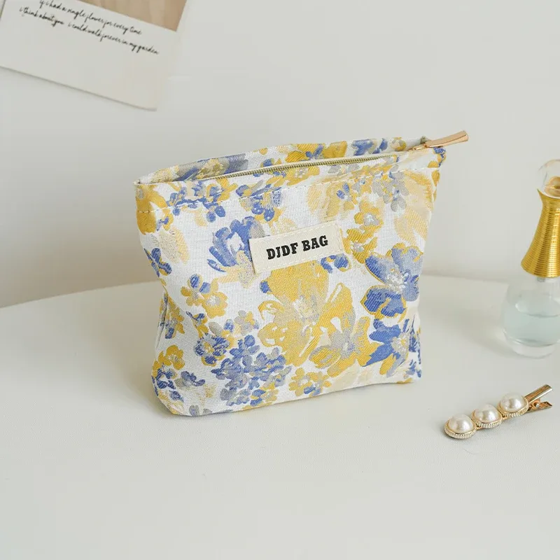 trousse polyester motif floral fleurs roses vertes fond blanc fermeture éclair voyage femmes cosmétiques maquillage sac rectangulaire