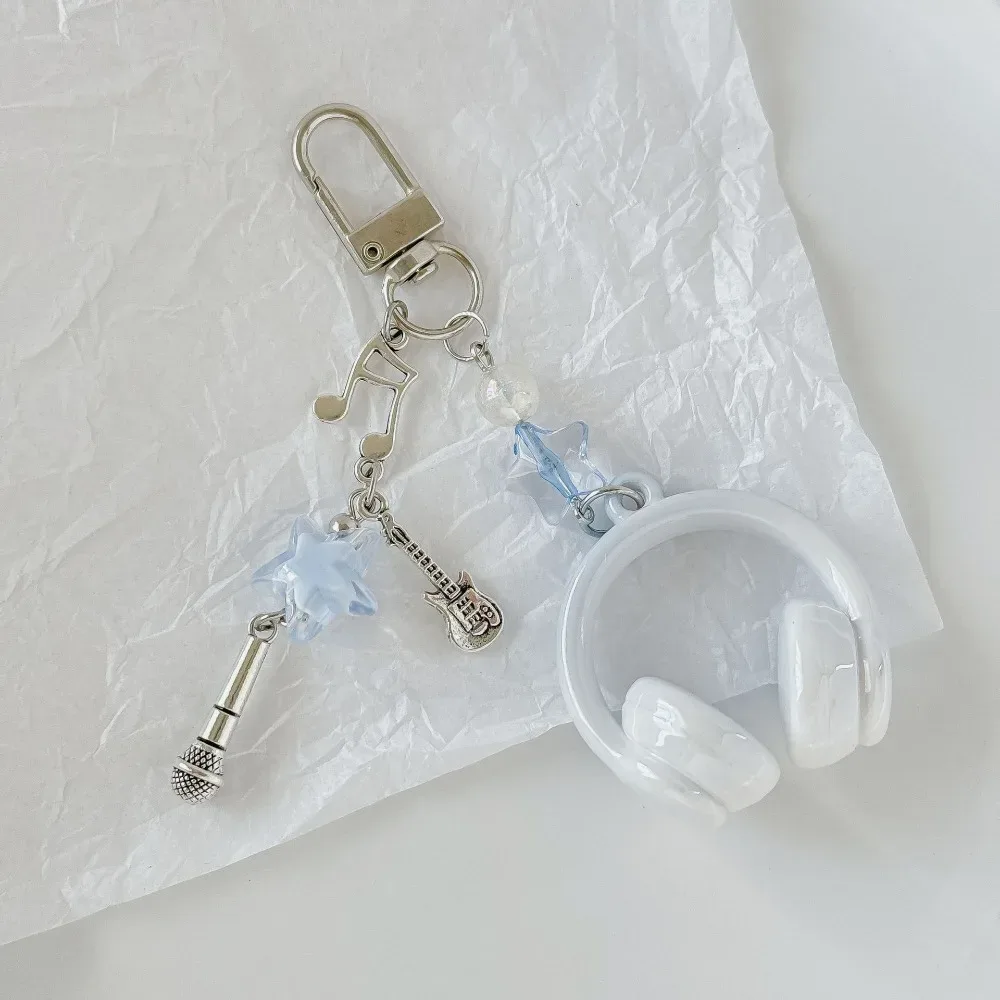 porte clé musical chaine métal accoutrements musicaux petit pendentif créatif voyage sac main pods casque bouton poussoir écouteurs accessoire voyage