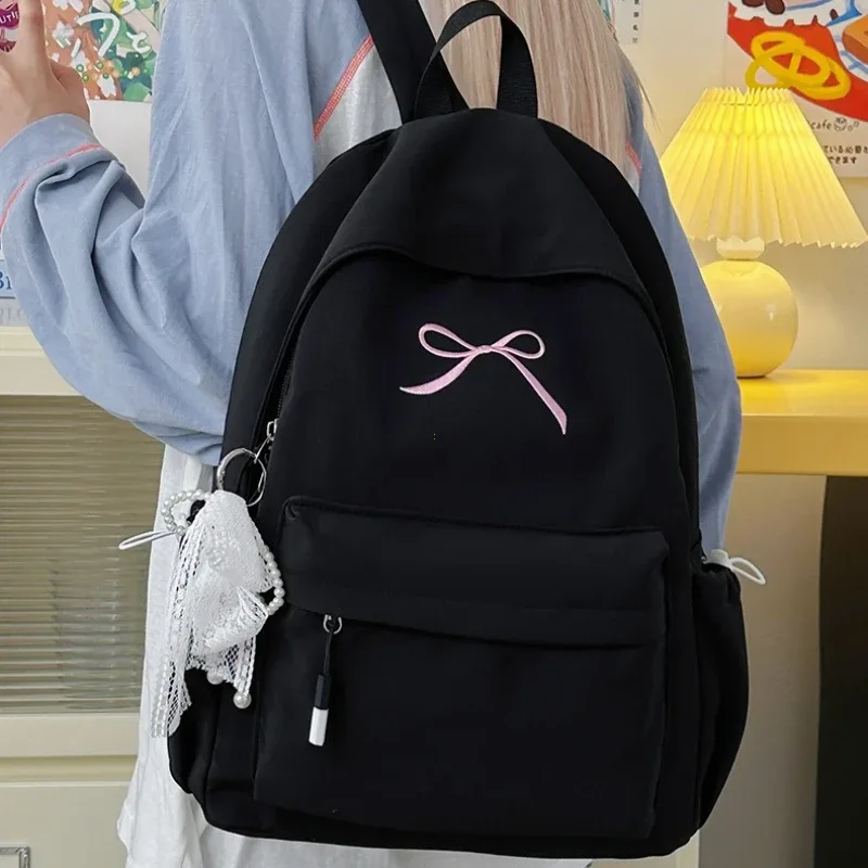 sac à dos portable brodé avec nœud pour filles, sac d'école en nylon de couleur unie pour étudiants, sac à dos de voyage léger de grande capacité pour femmes