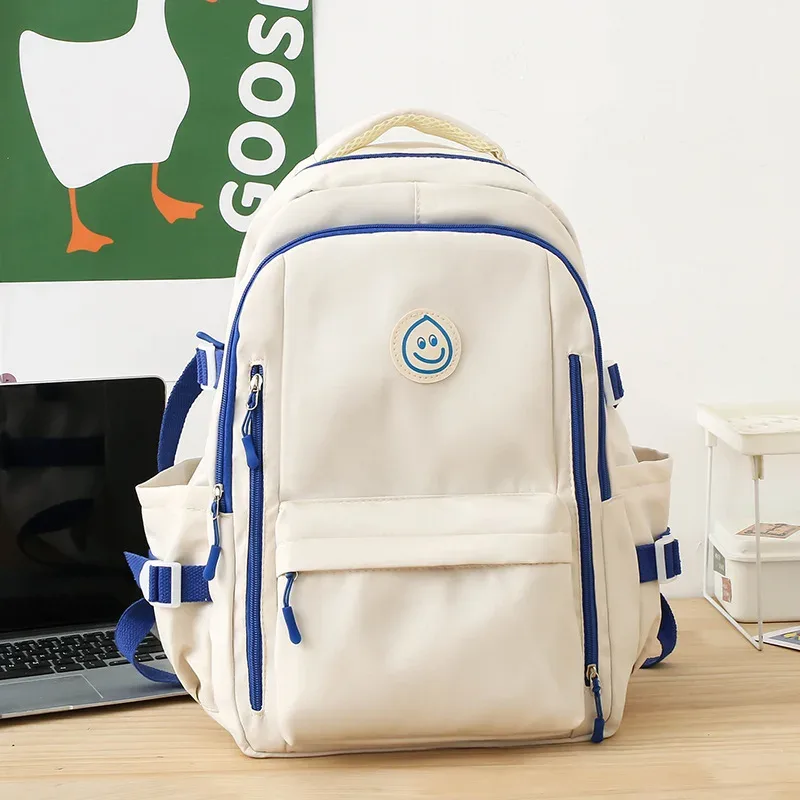sac dos nylon blanc rouge bleu patchwork bandoulière arquée poche ouverte informatique classement souple voyager école collège