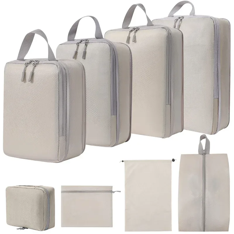 organisateur voyage polyester gris clair poignée noire fermeture glissière compressible sac chaussures rangement cube traçabilité usage polyvalent