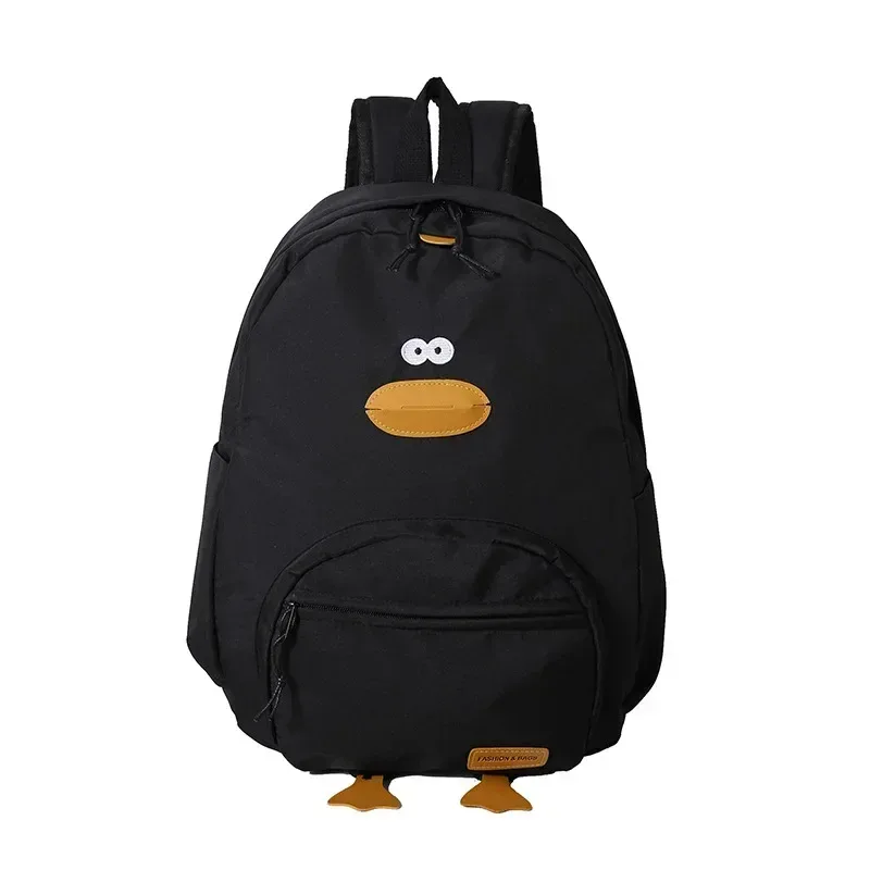 sac dos nylon noir jaune beige forme rectangulaire poignée souple bandoulière arquée fermeture glissière voyage femme étudiant école polyvalent