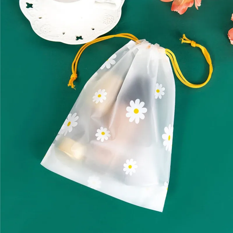 organisateur voyage transparence motif fleurs blanches fond gris corde jaune nylon plastique petit moyen grand