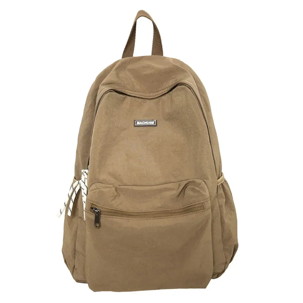 sac dos nylon beige clair pliable grande capacité bandoulière arquée poche intérieure zippée usage voyage décontracté