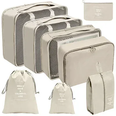 organisateur voyage polyester beige clair tissu imperméable poches maille transparente fermetures glissière poignées intégrées grande taille