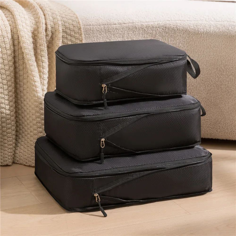 organisateur voyage nylon noir beige compressible cube sac rangement format rectangulaire zips noirs usage voyage empilement sol clair
