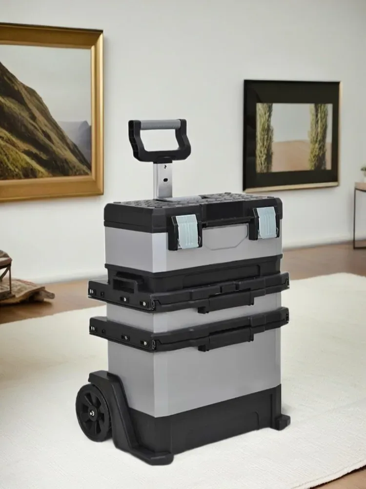 valise aluminium grise roulettes fixes poignées bleues compartiments superposés transport voyage travaux hausse atelier