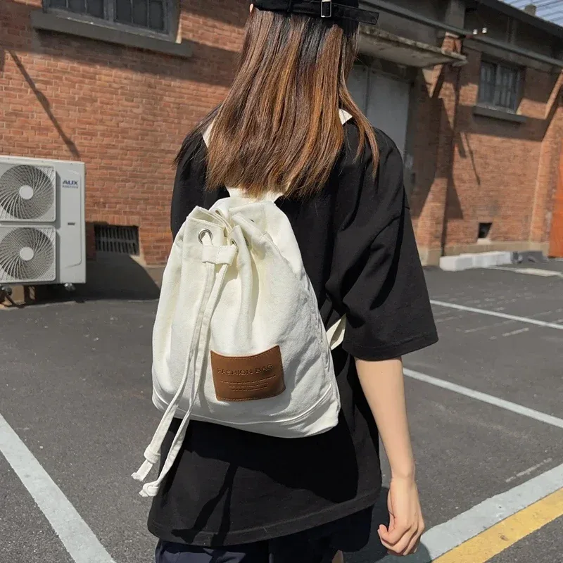 sac d'école solide décontracté, sac à dos en toile à la mode, sac à dos de grande capacité pour les déplacements, sac de voyage pour étudiants, nouvelle collection 2026