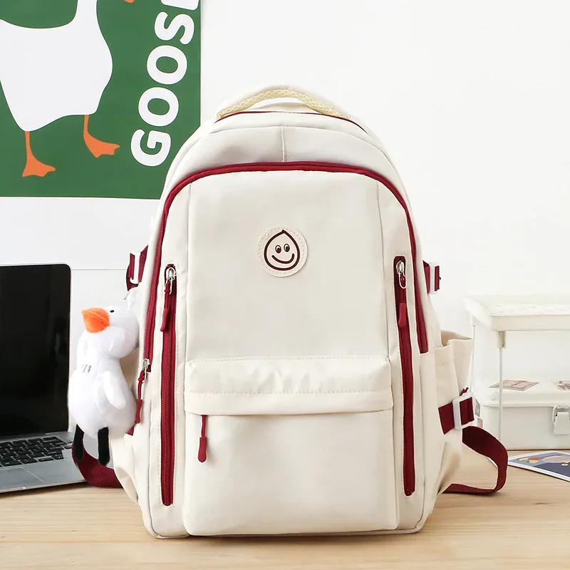 sac dos nylon blanc rouge bleu patchwork bandoulière arquée poche ouverte informatique classement souple voyager école collège