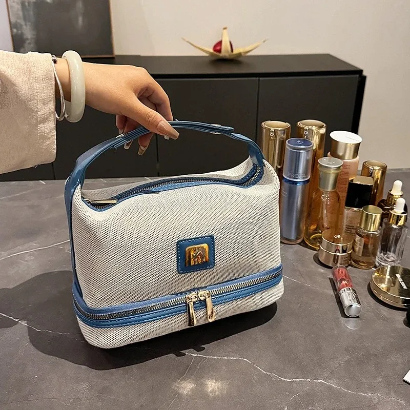 nouvelle trousse de maquillage portable en toile rétro de luxe avec étiquette métallique, de haute qualité et multifonctionnelle, idéale pour les voyages.