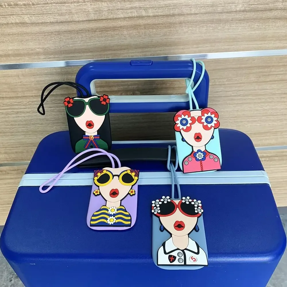 étiquette bagage caoutchouc visage lunettes fleurs géométrique bleu rose blanc voyage identification valise nom téléphone