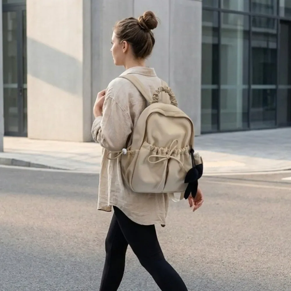 sac à dos en nylon pour étudiants avec cordon de serrage, bretelles réglables, design plissé, sac de voyage souple de grande capacité, sac à dos avec nœud.
