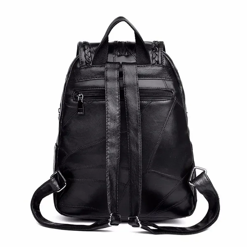 sac dos cuir noir bandoulière arquée fermeture éclair poches lateral pompon decoratif usage voyage polyvalent