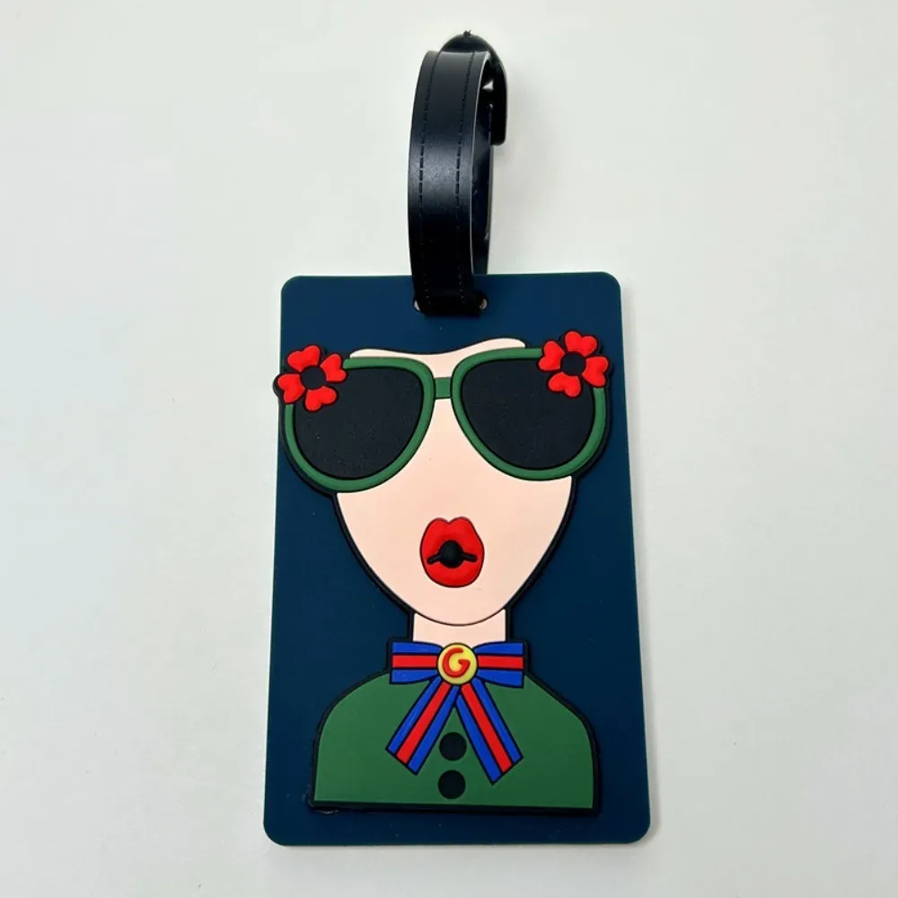 étiquette bagage caoutchouc visage lunettes fleurs géométrique bleu rose blanc voyage identification valise nom téléphone