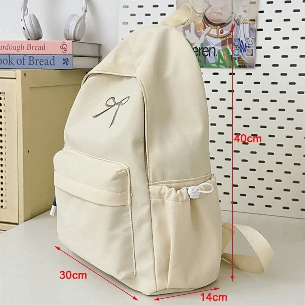 sac à dos portable avec nœud brodé pour filles, cartable en nylon de couleur unie pour étudiants, sac à dos de voyage léger de grande capacité