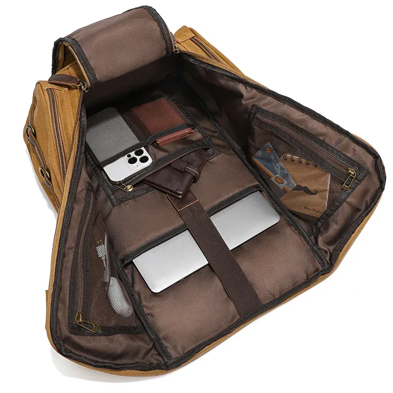 sac à dos en toile décontracté avec accents en cuir, plusieurs poches zippées et anneaux métalliques, sac à dos de voyage rétro de grande capacité pour hommes