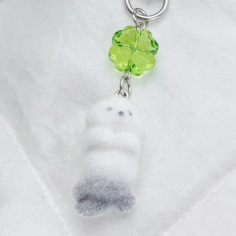 breloque de téléphone anime mignonne en forme de loutre, pendentif caméra trèfle à quatre feuilles kawaii, porte-clés tendance et élégant, décoration pour sac à dos, cadeau