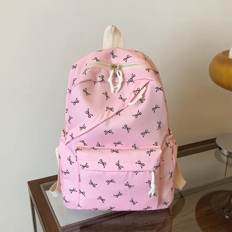 sac à dos tendance et mignon avec imprimé de nœuds, sac à dos pour ordinateur portable avec protection pour ordinateur portable, bretelles réglables, sac à dos pour ordinateur portable pour la rentrée scolaire.