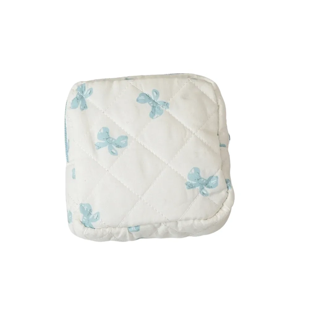 sac de rangement pour serviettes hygiéniques à motif à carreaux, sac cosmétique multifonctionnel, mini sac de voyage matelassé portable pour maquillage.