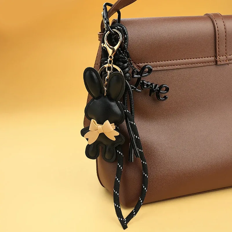adorable porte-clés en cuir pu en forme de lapin avec petit nœud, pendentif animal mignon pour sacs à main et sacs à dos.