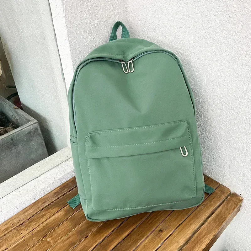 haute qualité nouveau imperméable à l'eau en nylon femmes sac à dos femme sac de voyage sacs à dos cartable pour adolescentes couleur unie bookbag