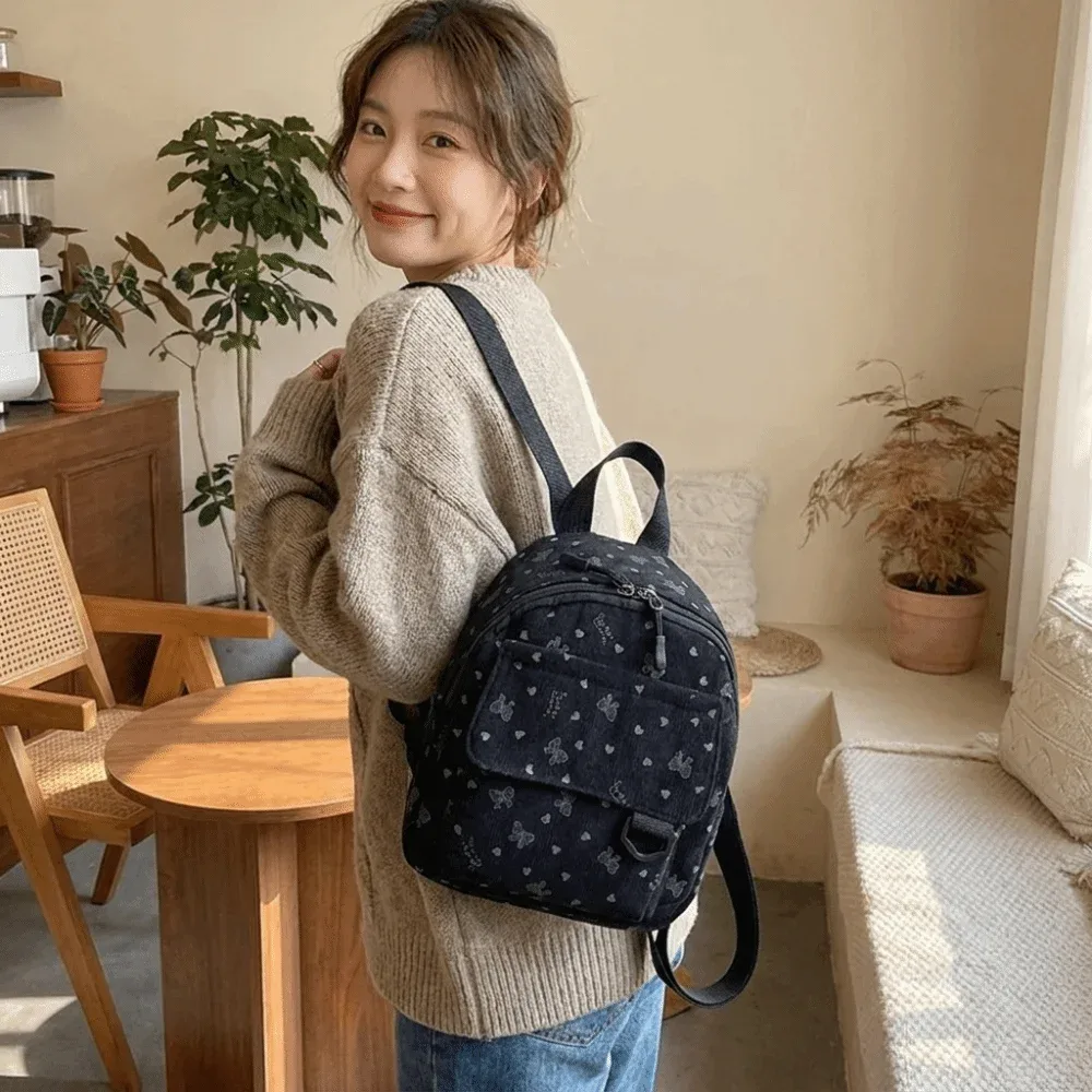 mini sac à dos en velours côtelé léger avec imprimé cœur et nœud, sac à bandoulière multi-compartiments à ouverture zippée, sac à dos quotidien