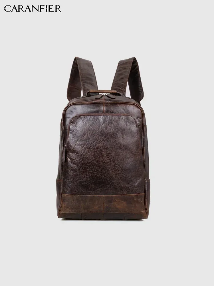 sac dos cuir véritable marron foncé poignées boucles métalliques pochette latérale bandoulière arquée fermeture éclair informatique voyage